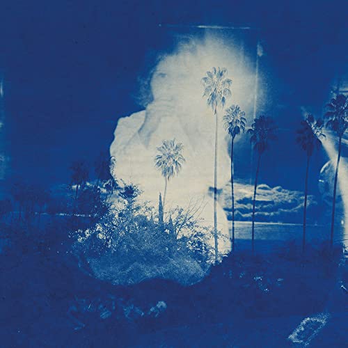 Blue-toned album cover with a ghostly figure and palm trees.
