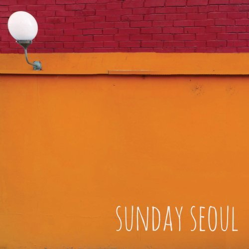 CD cover with a street lamp against a red and orange wall.