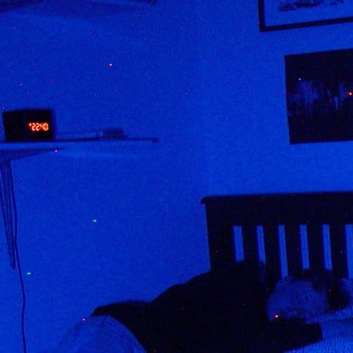 Blue vinyl record on a shelf with a digital clock reading 22:30.