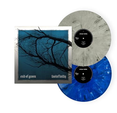 Two vinyl records and album cover with a tree silhouette.