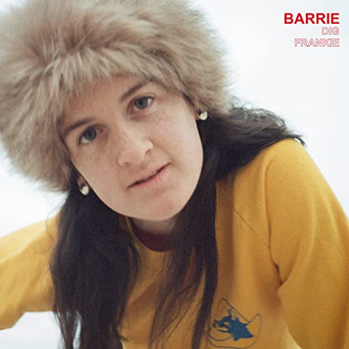 Barrie album cover: woman in yellow sweater and fur hat.