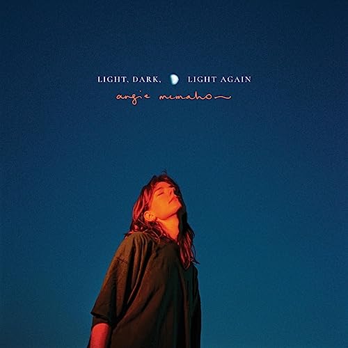 Album cover for Angie McMahon’s “Light, Dark, Light Again” with a portrait.