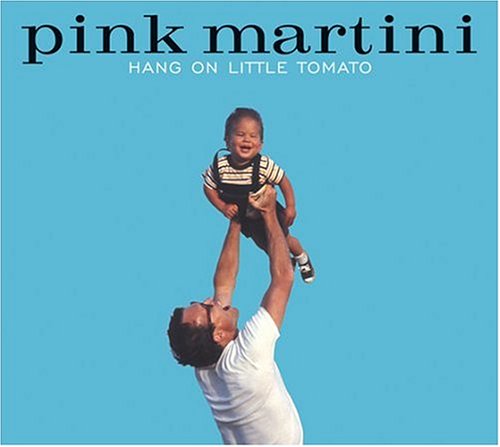 Pink Martini album cover: a man tossing a smiling baby in the air.