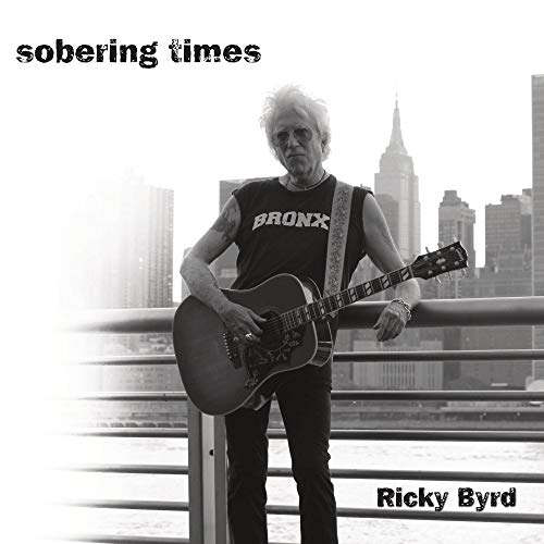 Black and white album cover featuring Ricky Byrd with a guitar, city skyline.