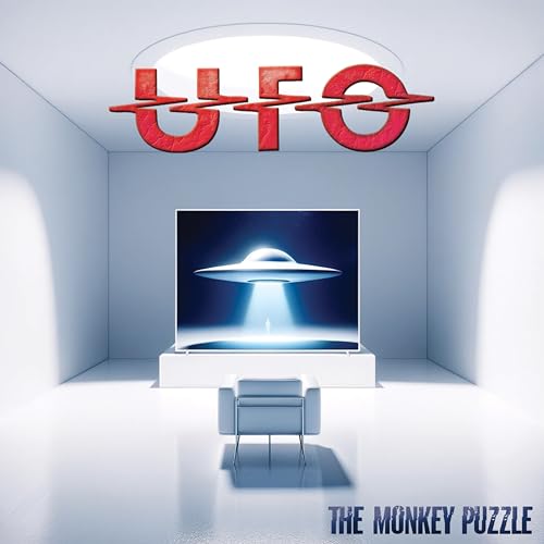 UFO album cover: a white room with a UFO image on a screen.