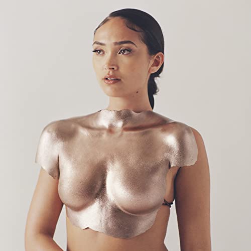 Woman with metallic gold covering her chest and shoulders.