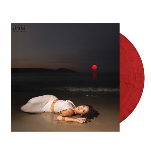 Vinyl record with album cover featuring a woman lying on a beach.