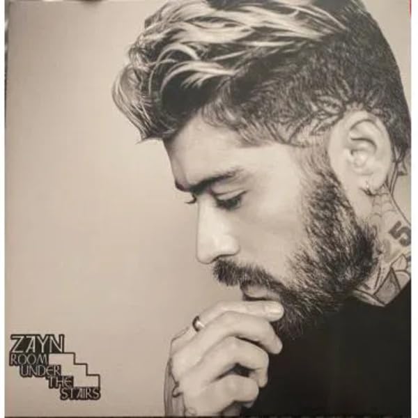 Black and white vinyl album cover featuring Zayn with facial tattoos.