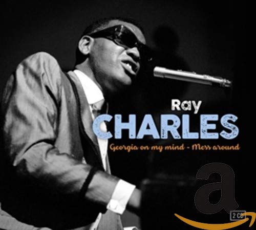 Ray Charles in sunglasses singing into a microphone, album cover.