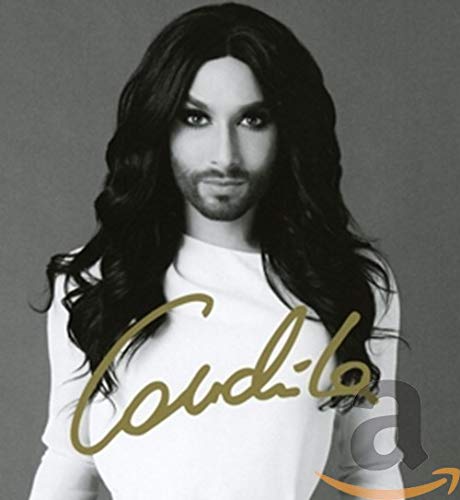 Black and white portrait of Conchita Wurst with long dark hair.