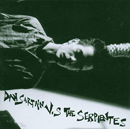 Black and white album cover featuring a man and text: "Dan Sartain V.S The Serpientes".