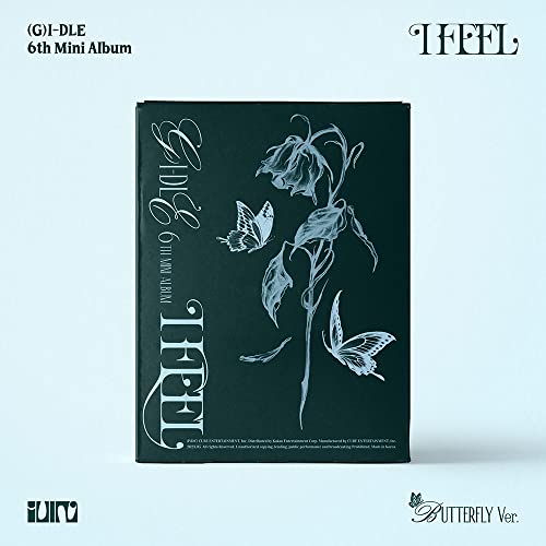 Dark green album cover with floral design and butterflies, "(G)I-DLE I FEEL".