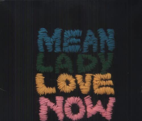 Embroidered text reading "Mean Lady Love Now" on black corduroy.