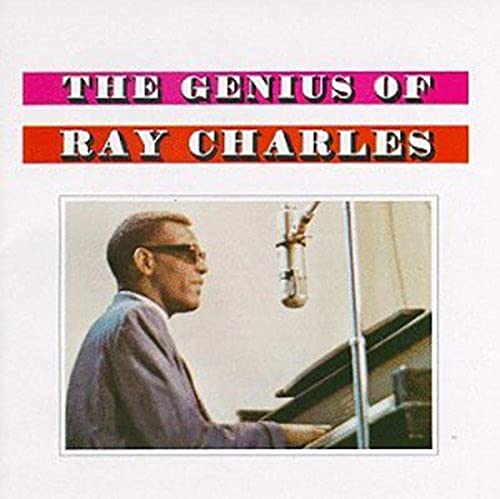 Ray Charles album cover featuring him at a piano with a microphone.