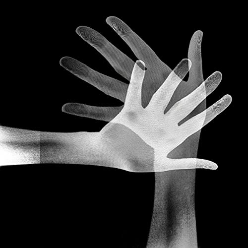 Black and white image of layered, translucent hands reaching upwards.
