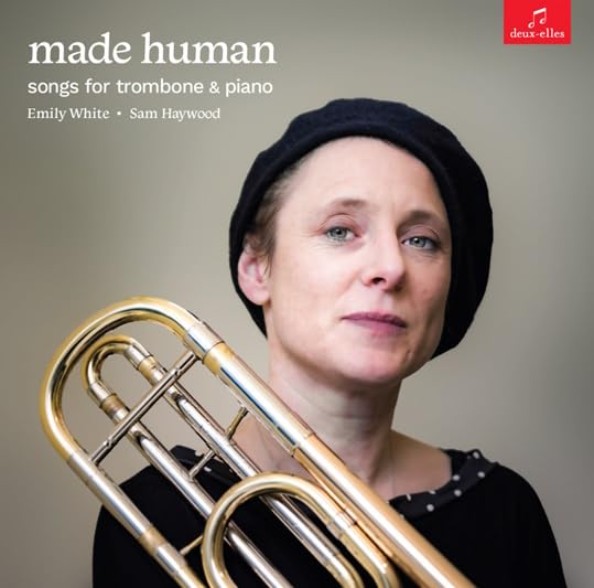 CD cover: Woman with trombone, text “made human” and artist names.