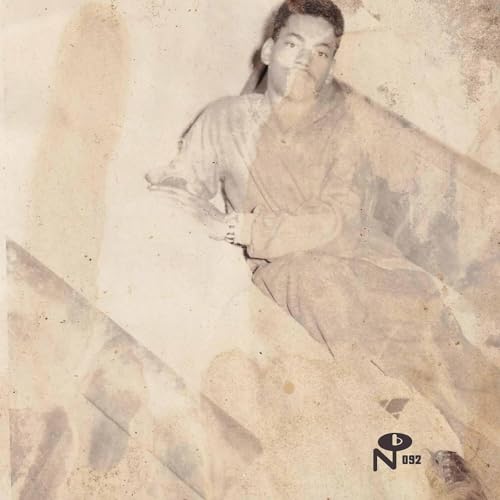 Sepia-toned vinyl record cover featuring a portrait of a man reclining.