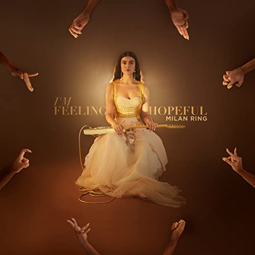 Album cover: woman with guitar, surrounded by reaching hands.