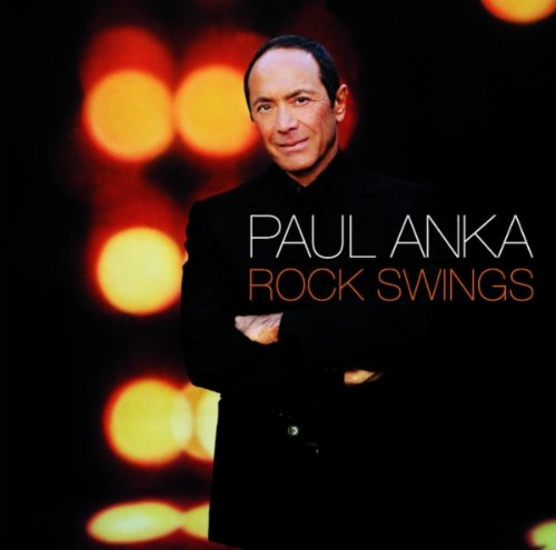 Paul Anka portrait on album cover with blurred golden lights background.