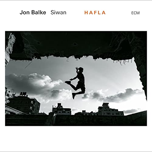 CD cover: person jumping within a shadowed, architectural frame.