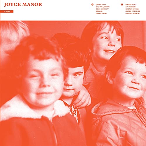 Red-toned vinyl album cover featuring a vintage photo of four children.