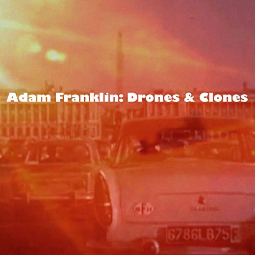 Album cover for Adam Franklin’s “Drones & Clones” featuring a car and building.