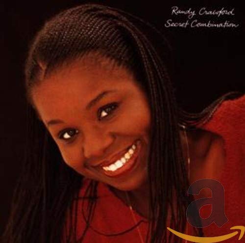 CD cover featuring a smiling Black woman with braided hair.
