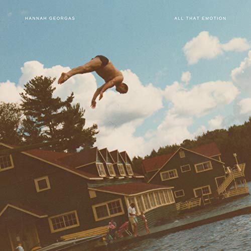 Album cover: a man diving over lakeside cabins under a cloudy sky.