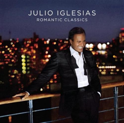 Julio Iglesias album cover featuring the artist smiling against a city skyline.