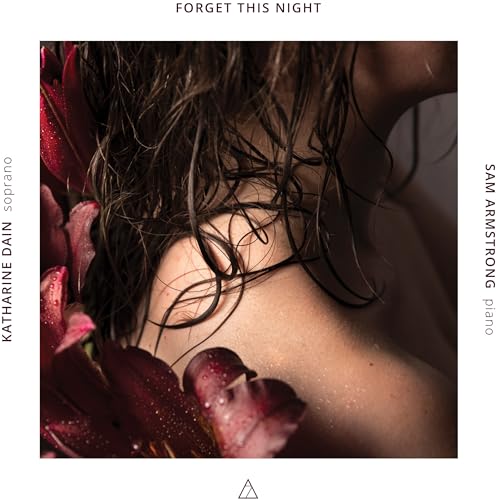CD cover: woman’s shoulder and wet hair with red flowers.
