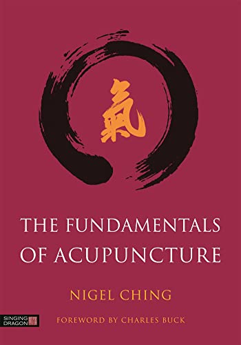 Book cover: "The Fundamentals of Acupuncture" with a black ink circle and red characters.