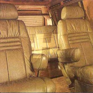 CD cover depicting the interior of a vintage van with tan seats.