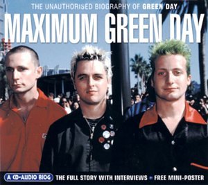 Green Day band members in matching jackets, with palm trees in background.