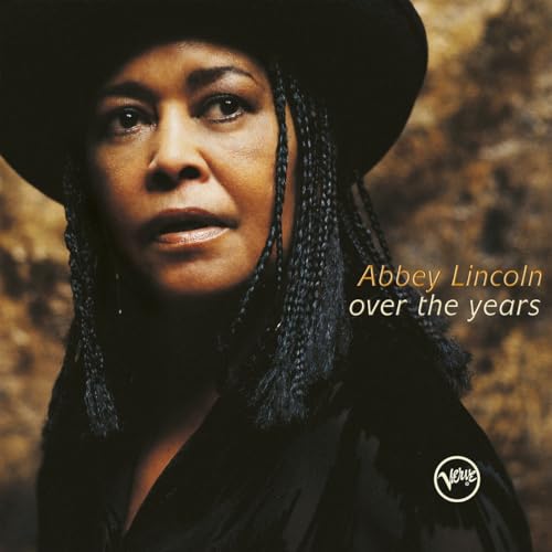 Abbey Lincoln portrait on album cover, wearing a dark hat and braids.