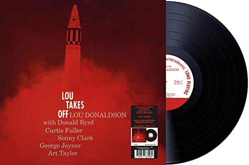 Vinyl record of “Lou Takes Off” with red rocket album cover.