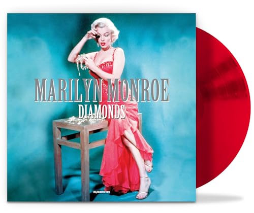 Marilyn Monroe album cover with red vinyl record beside it.