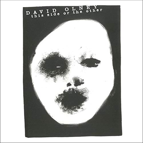 CD cover for David Olney’s “This Side Or The Other” with a stark face image.