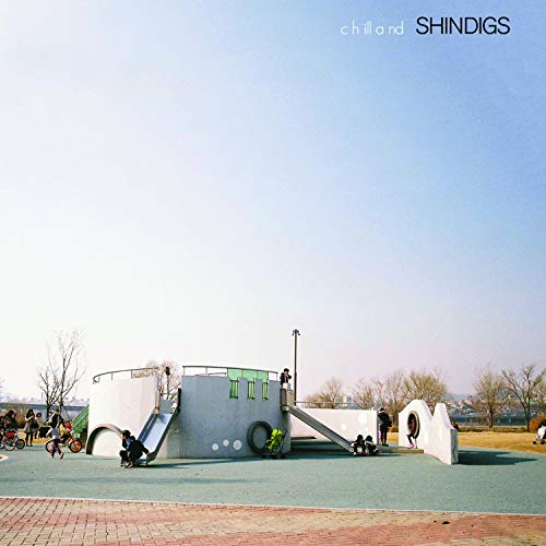 CD cover with a playground scene under a clear blue sky.