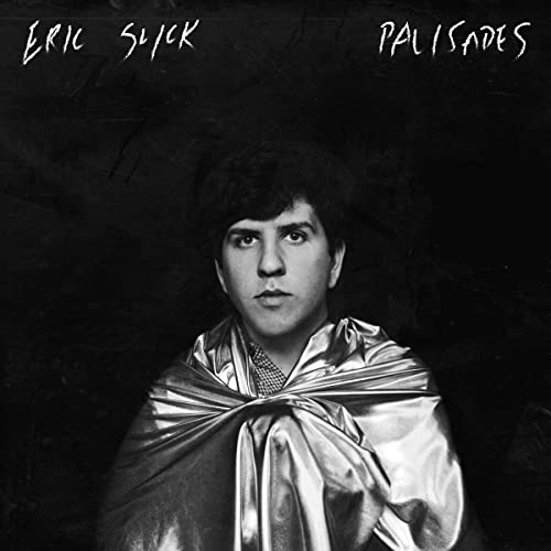 Black and white portrait of Eric Slick wrapped in silver plastic.
