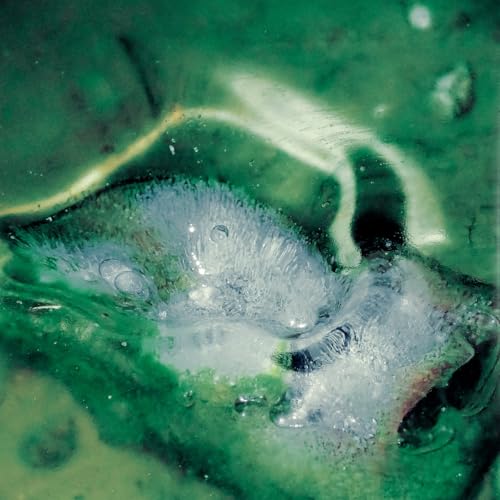 Abstract green and white swirls resembling water, vinyl record artwork.