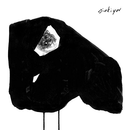 Black and white album cover with abstract ink blot and face imagery.