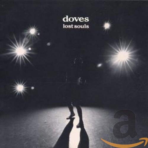 Black and white album cover with a lone figure under streetlights.