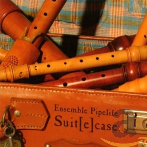 Brown wooden pipes and case with "Ensemble Pipelife - SUITE CASE" text.