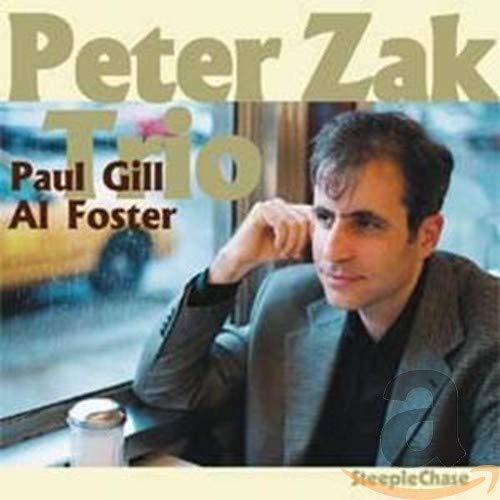 CD cover featuring Peter Zak, a man in a gray suit, looking right.