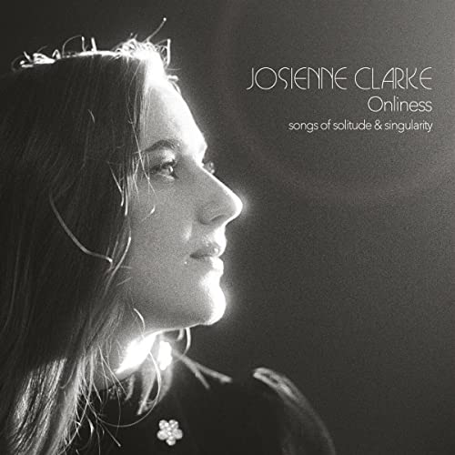 Black and white album cover featuring a woman in profile with a crown.