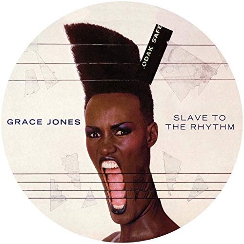 Grace Jones portrait with exaggerated hairstyle, album “Slave To The Rhythm”.