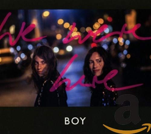 CD cover featuring two people with smeared makeup against a blurred city background.