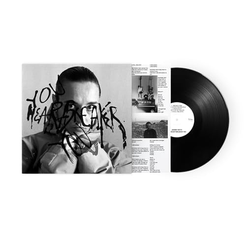 Black and white vinyl record with album cover featuring a person’s portrait.