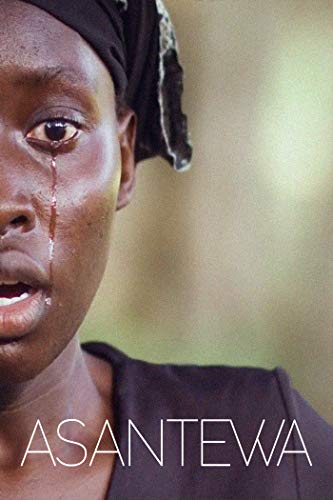 Close-up of a Black woman with a tear streaming down her face.