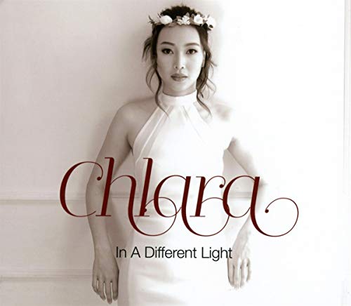 Album cover for Chlara’s “In A Different Light” featuring a woman in white.